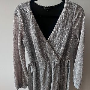 Silver sequinned mini dress, wrap style, long sleeved, size small